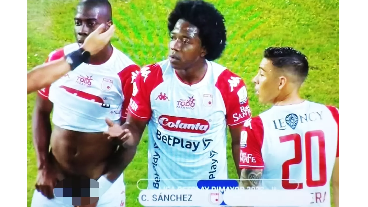 Fans stunned after footballer pulls down his shorts and exposes his manhood while defending a free-kick