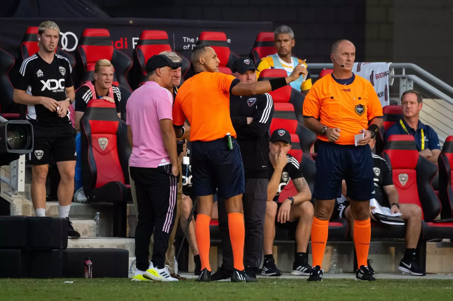 The referee discussed the incident with Rooney and Inter boss Phil Neville (Image: Alamy)