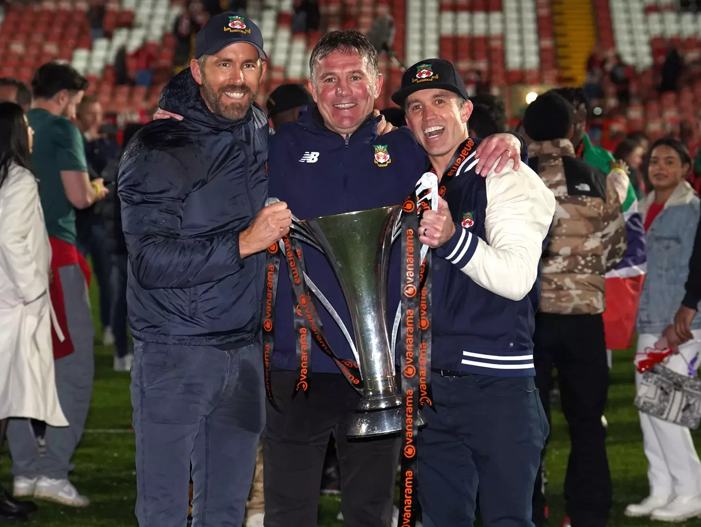 Wrexham manager Phil Parkinson flanked by Ryan Reynolds and Rob McElhenney. (Image: Alamy)