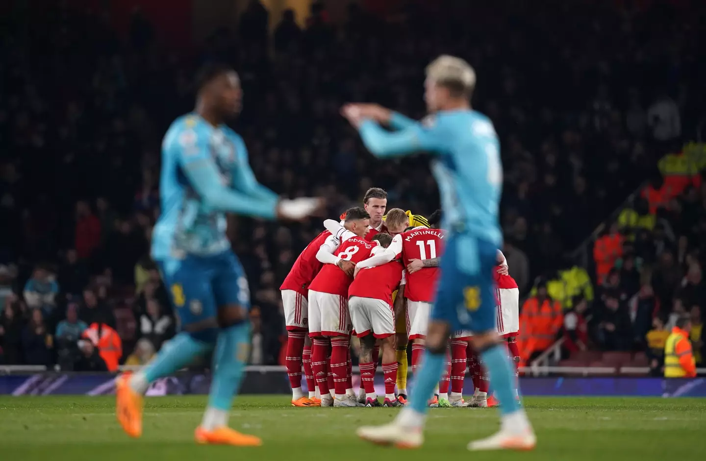 Arsenal players got into a huddle after conceding two in the opening 15 minutes. (