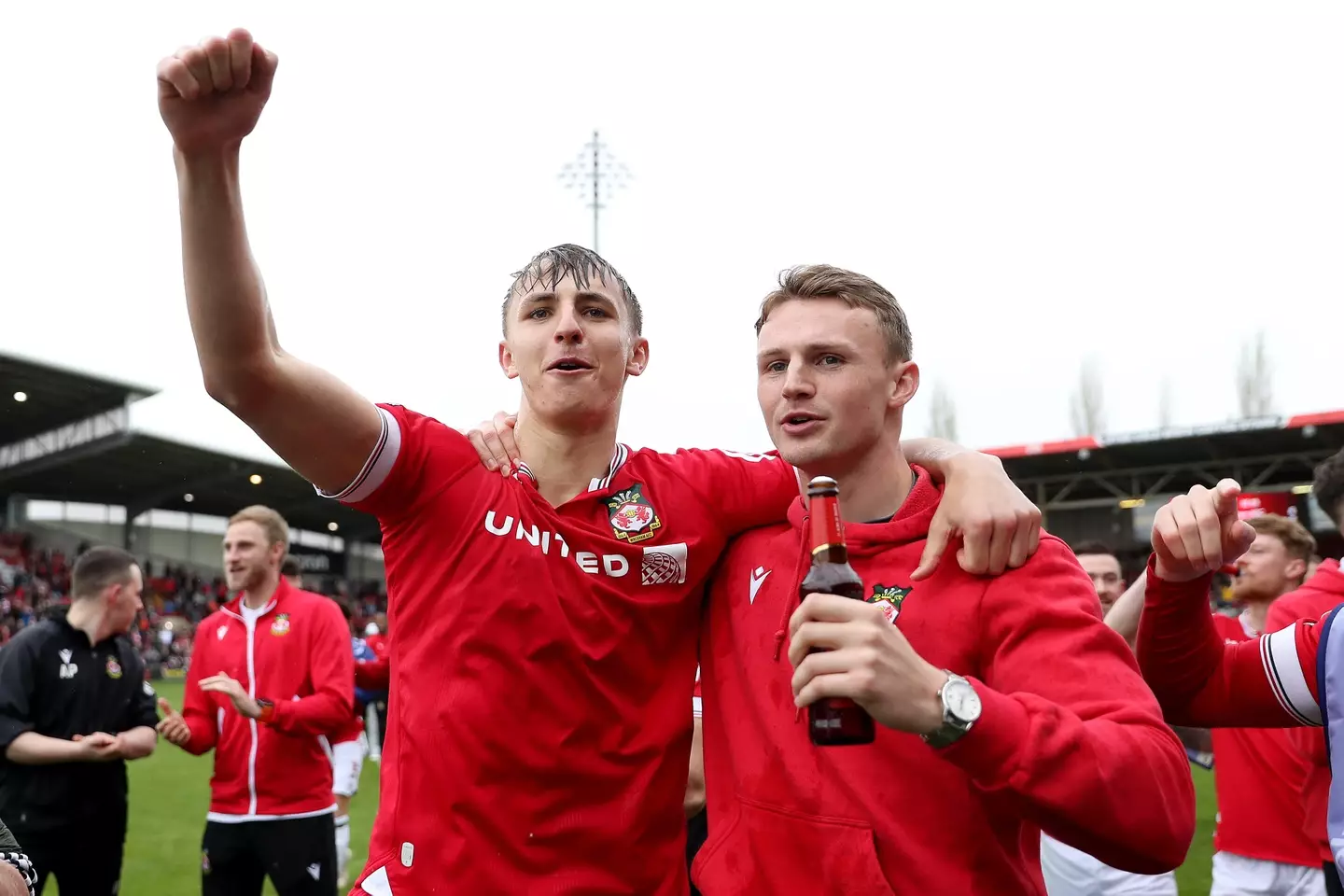 Max Cleworth and Sam Dalby celebrate Wrexham's promotion to League One. Image credit: Getty