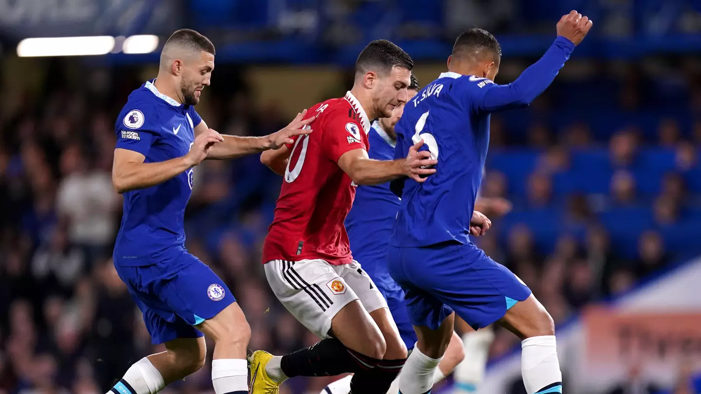 Manchester United's Diogo Dalot (centre) and Chelsea's Thiago Silva battle for the ball during the Premier League match at Stamford Bridge. (Alamy)