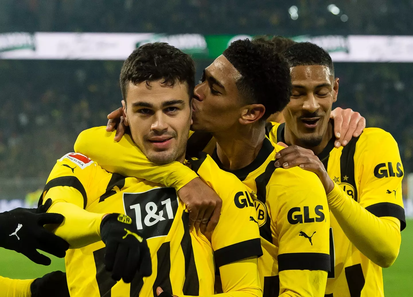 Jude Bellingham plants a kiss on Giovanni Reyna after a goal for Borussia Dortmund. Image: Getty