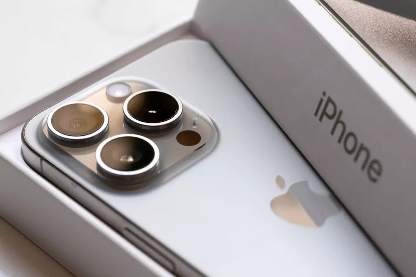 The latest iPhone has three camera lenses bulging from the back (ohn Keeble/Getty Images)