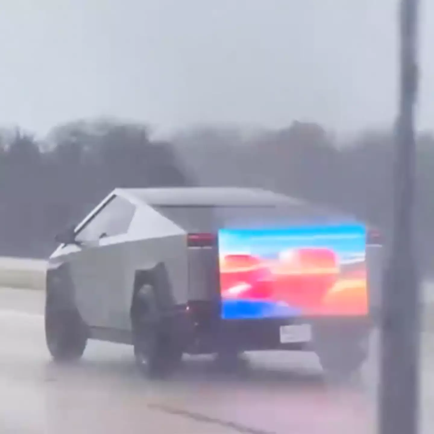 Drivers left baffled after seeing Cybertruck on freeway with TV on the back