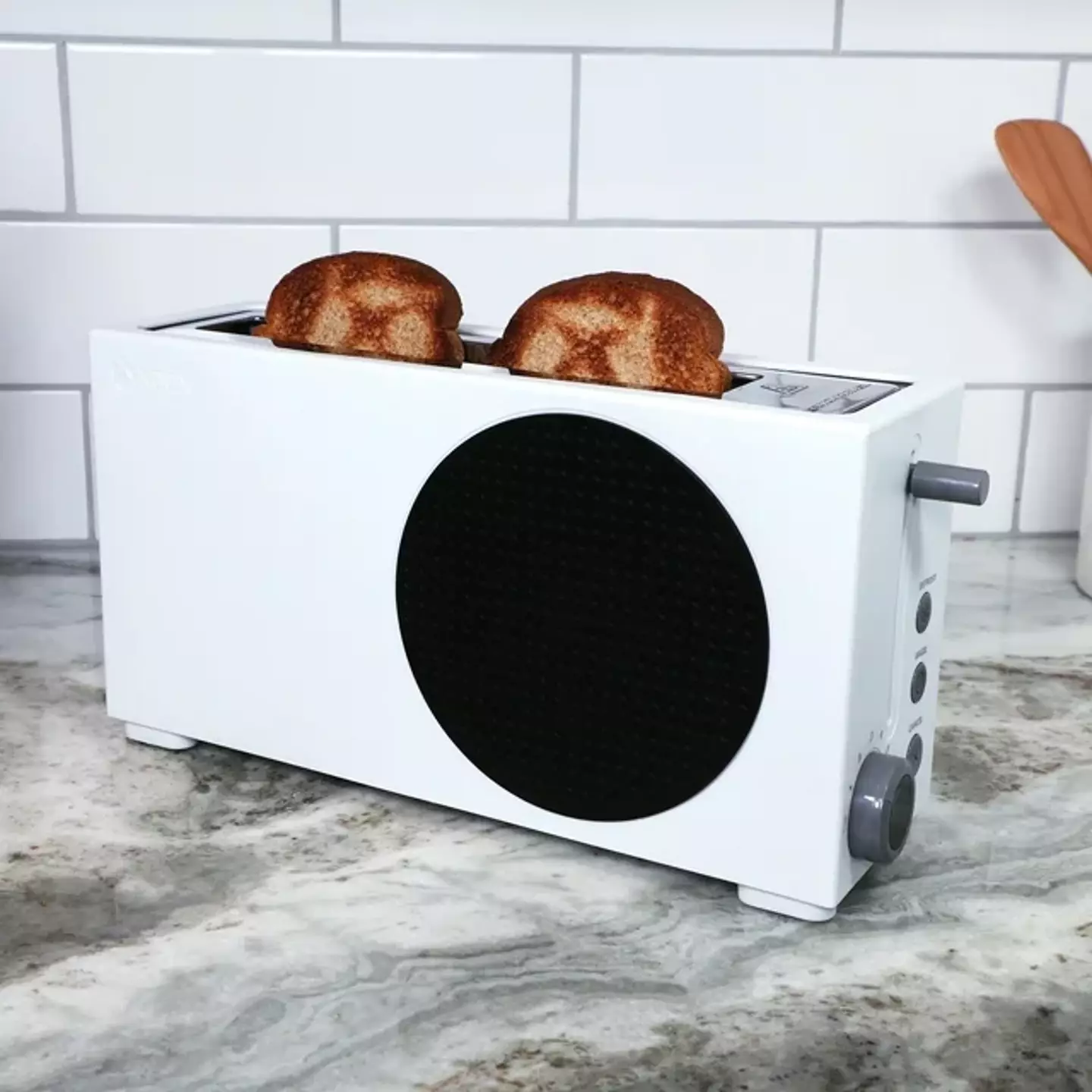 The toaster would sit nicely next to the Xbox-themed fridge.