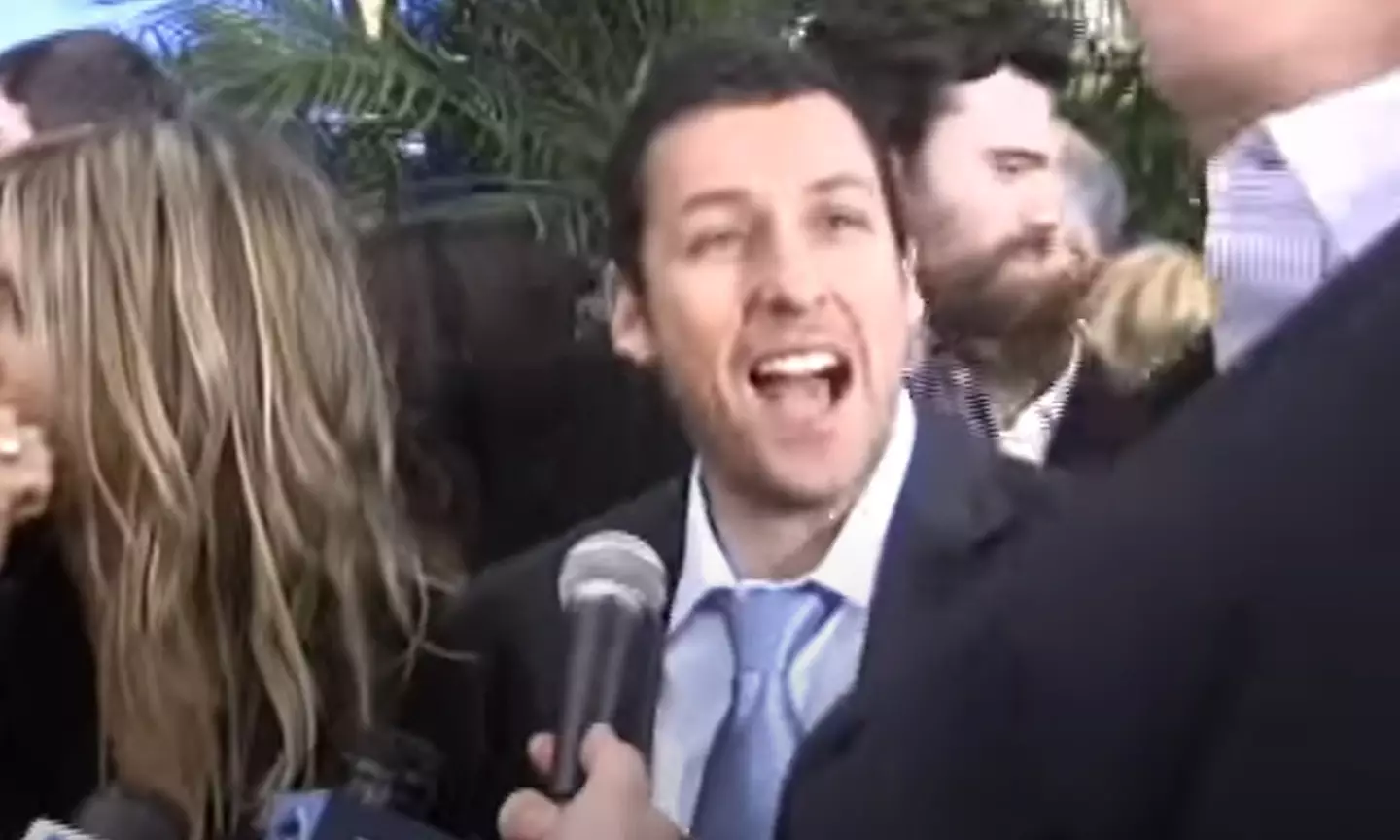 People are loving that Adam Sandler's response was to yell 'oh my god that's awful' once he realised how tall the interviewer was.