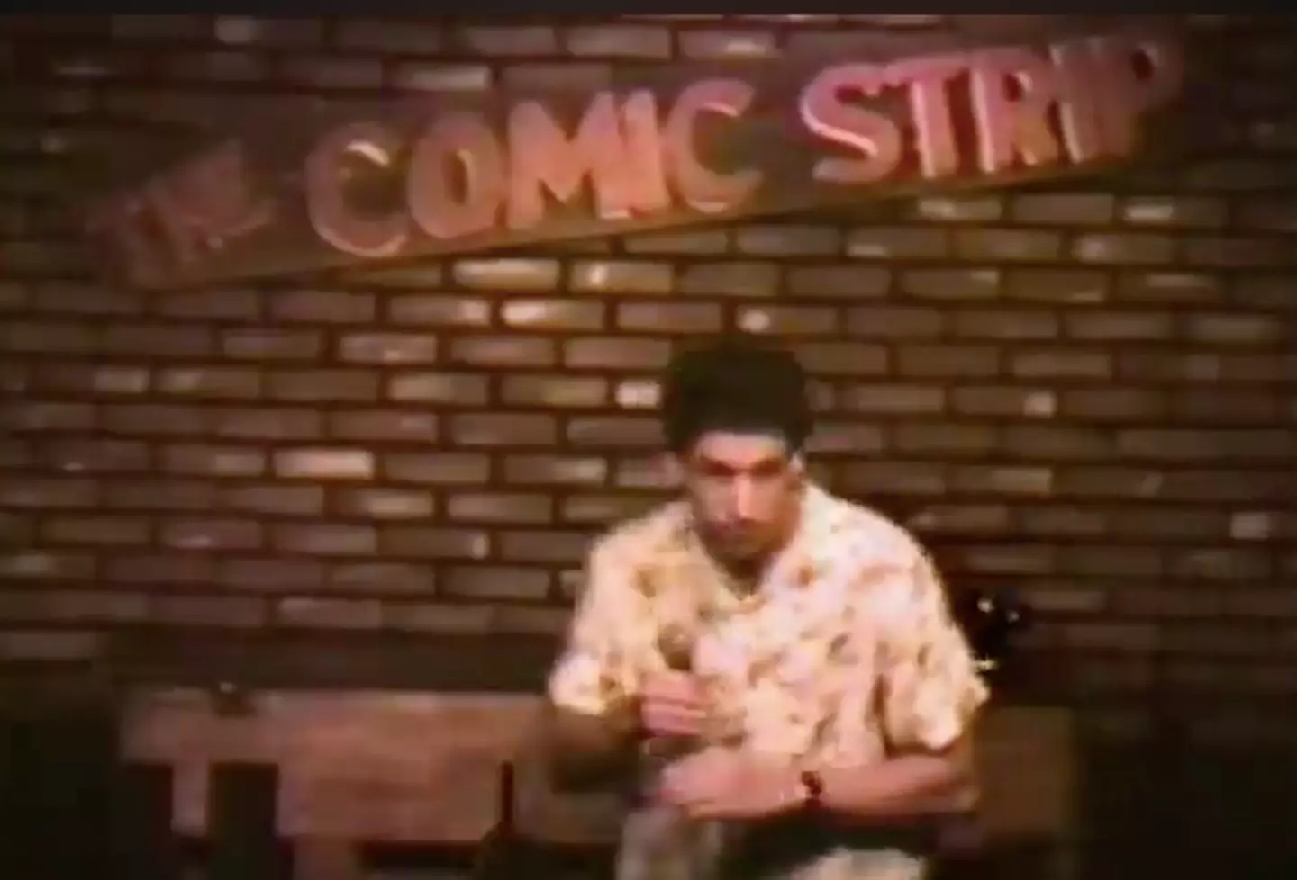 The grainy footage shows Sandler at the beginning of his career.