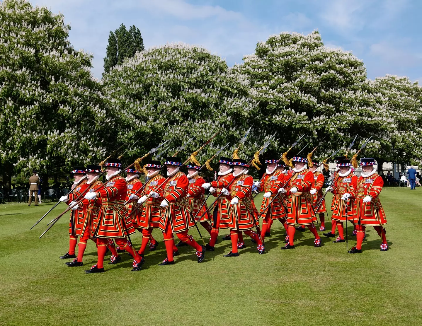 This is what the Beefeaters actually wear. Checkmate, Wayne.