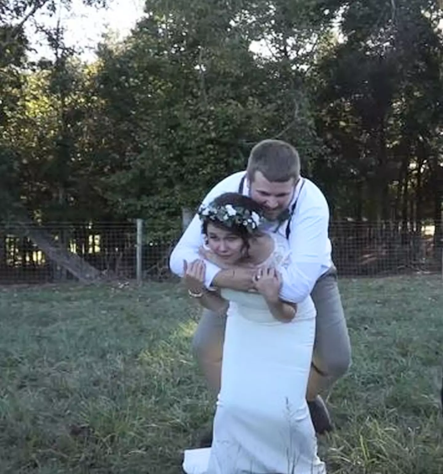 The happy couple were taking wedding photos after tying the knot, then the bride's ankle snapped. (Kennedy News and Media)