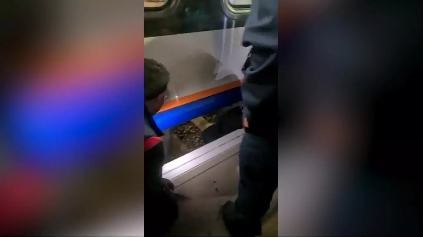 The man was spotted by a quick-thinking woman who was able to stop the train and save his life.