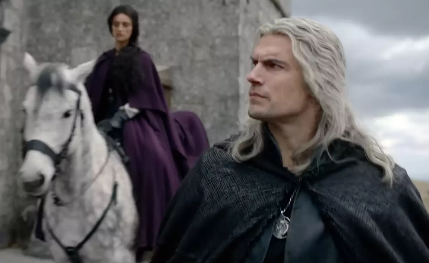 Henry Cavill as Geralt and Anya Chalotra as Yennfer in a still from the trailer.
