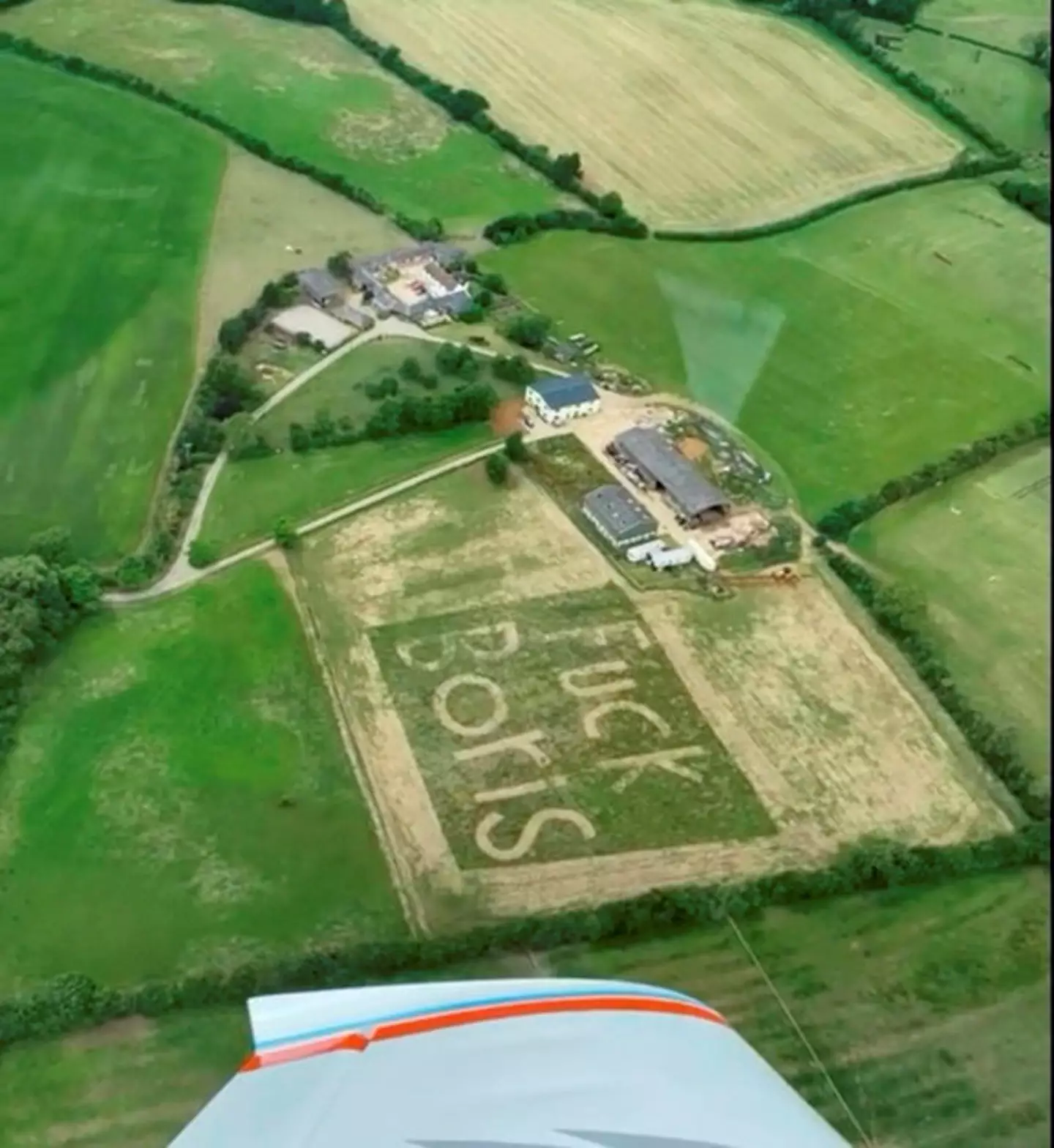 A pilot has spotted the words ‘F**K BORIS’ mowed into a field.
