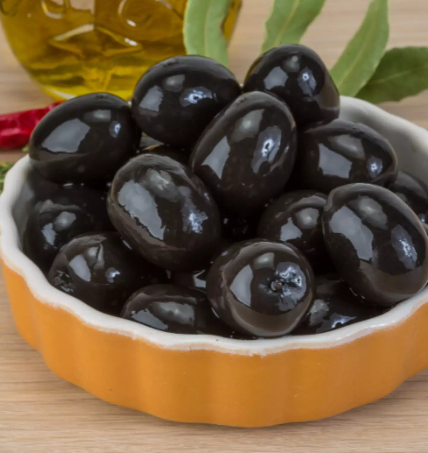 Eating just seven olives a day can be good for you, but there are some downsides too (Getty Stock Images)