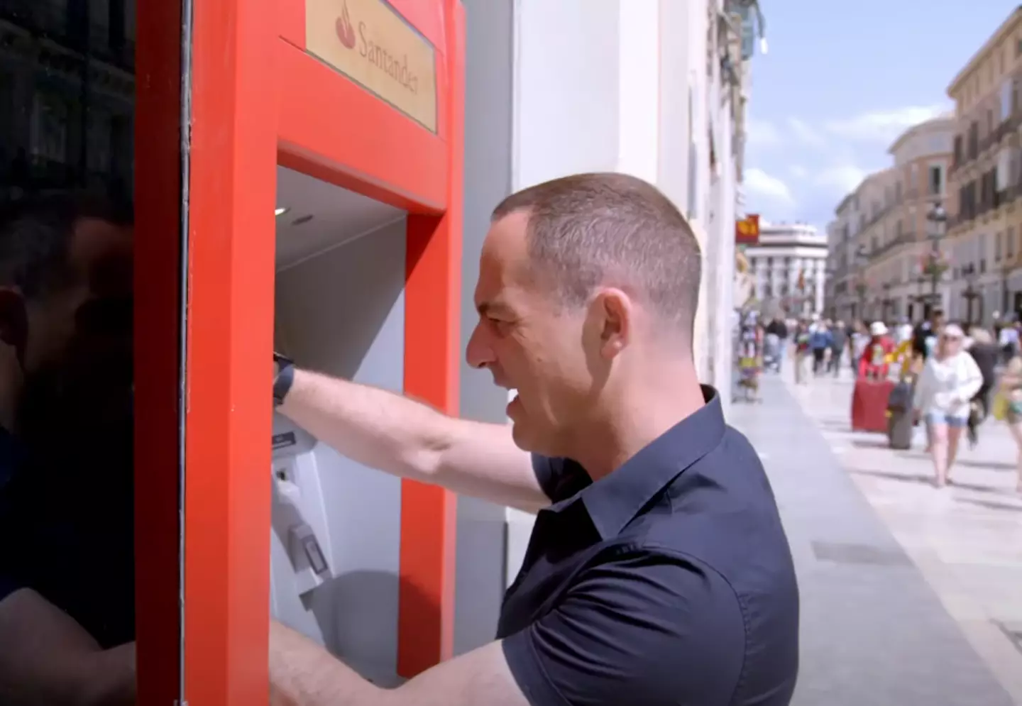 Martin Lewis using a cash machine in Spain (ITV)