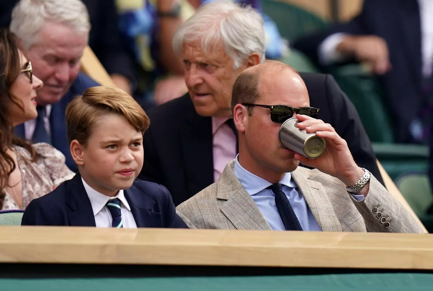 The Royal Family have faced backlash after Prince George was spotted wearing a suit at Wimbledon in 30 degree heat.