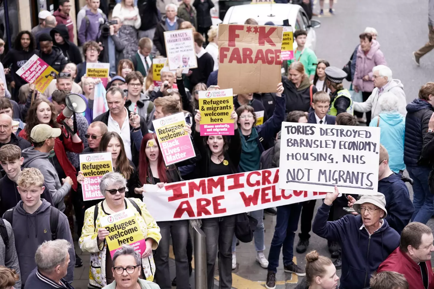 There were demonstrations against the Reform UK leader as his bus toured Barnsley. (PA)