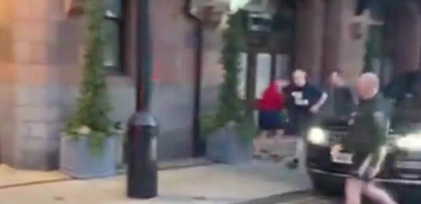 Johnson can be seen waving to reporters in the resurfaced video.