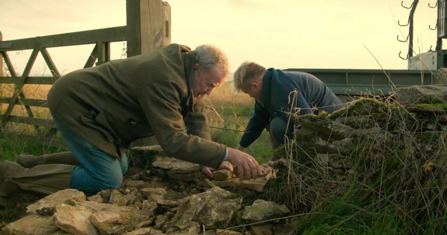 Jeremy and Kaleb putting together a dry stone wall that Gerald would usually do with ease (Prime Video)