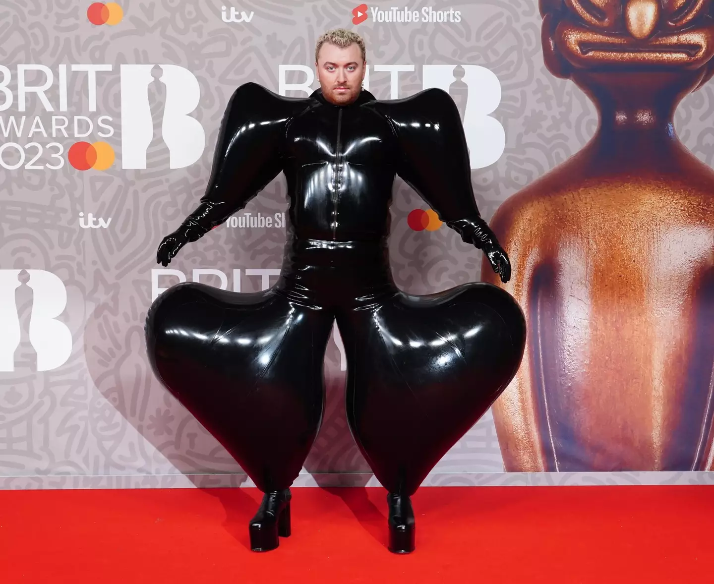 Sam Smith wore an all-black inflated jumpsuit look to the 2023 Brit Awards.