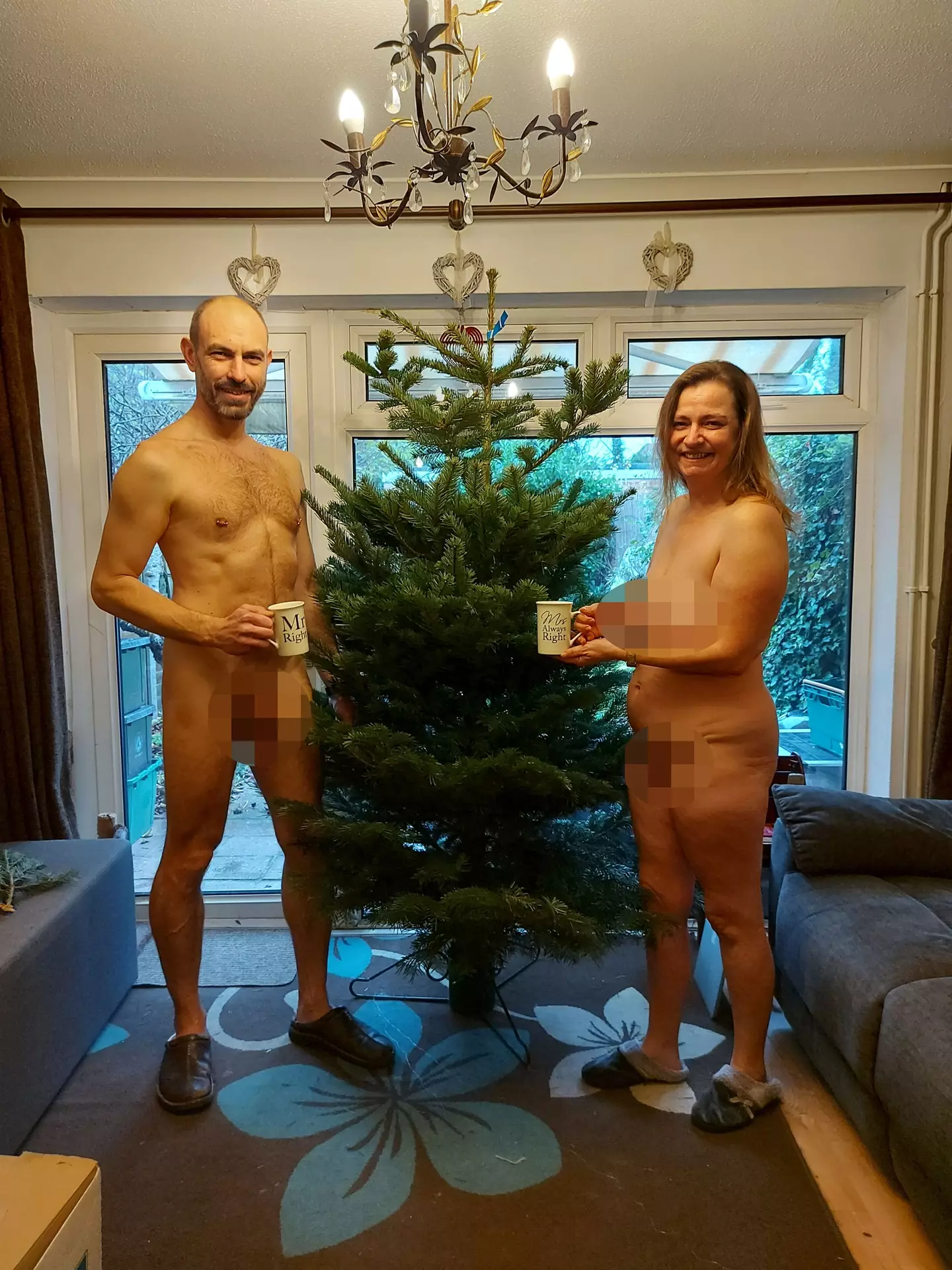 Helen and Simon Berriman standing proud by their Christmas tree.