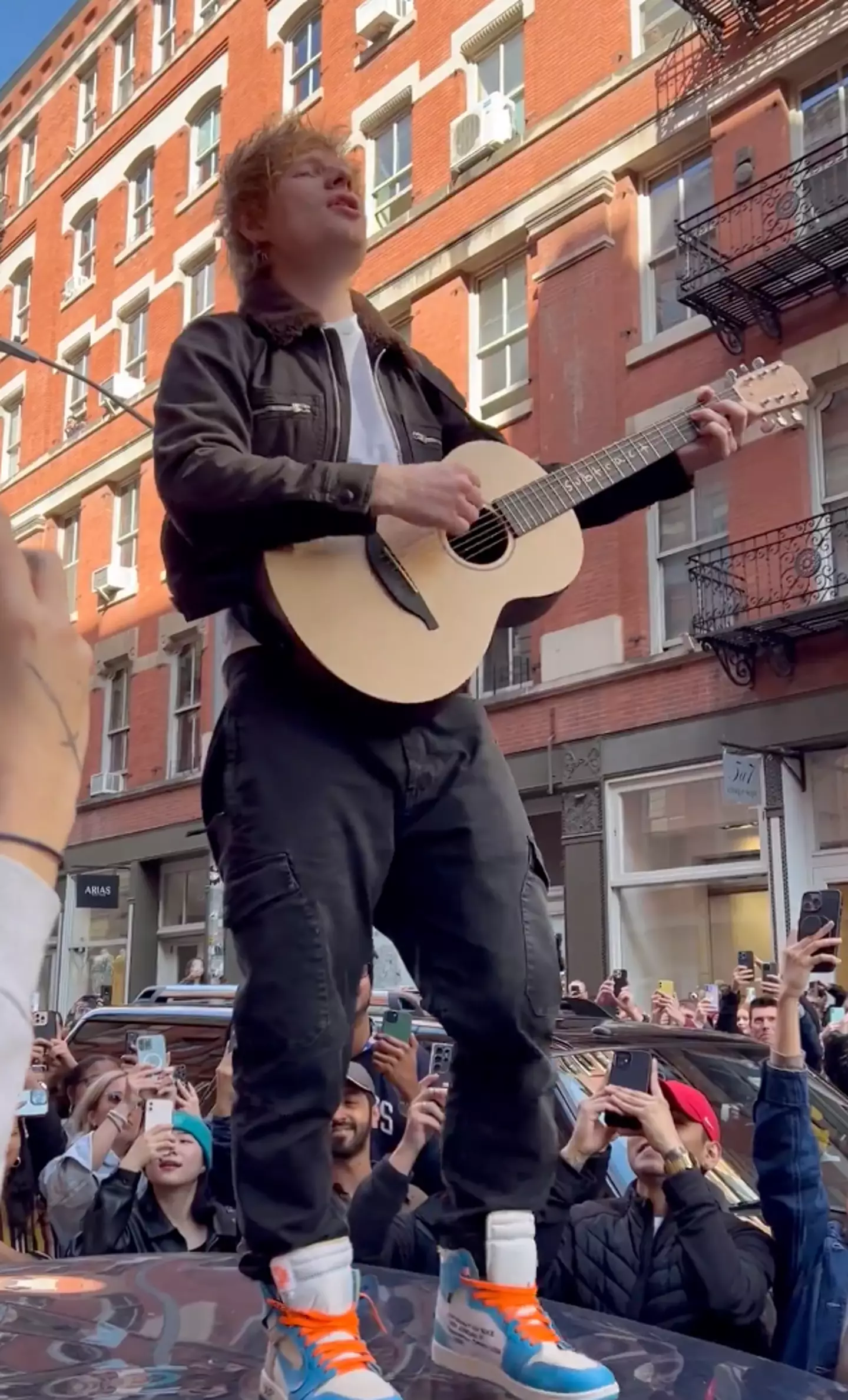 Ed Sheeran performed to fans outside a pop-up in New York.