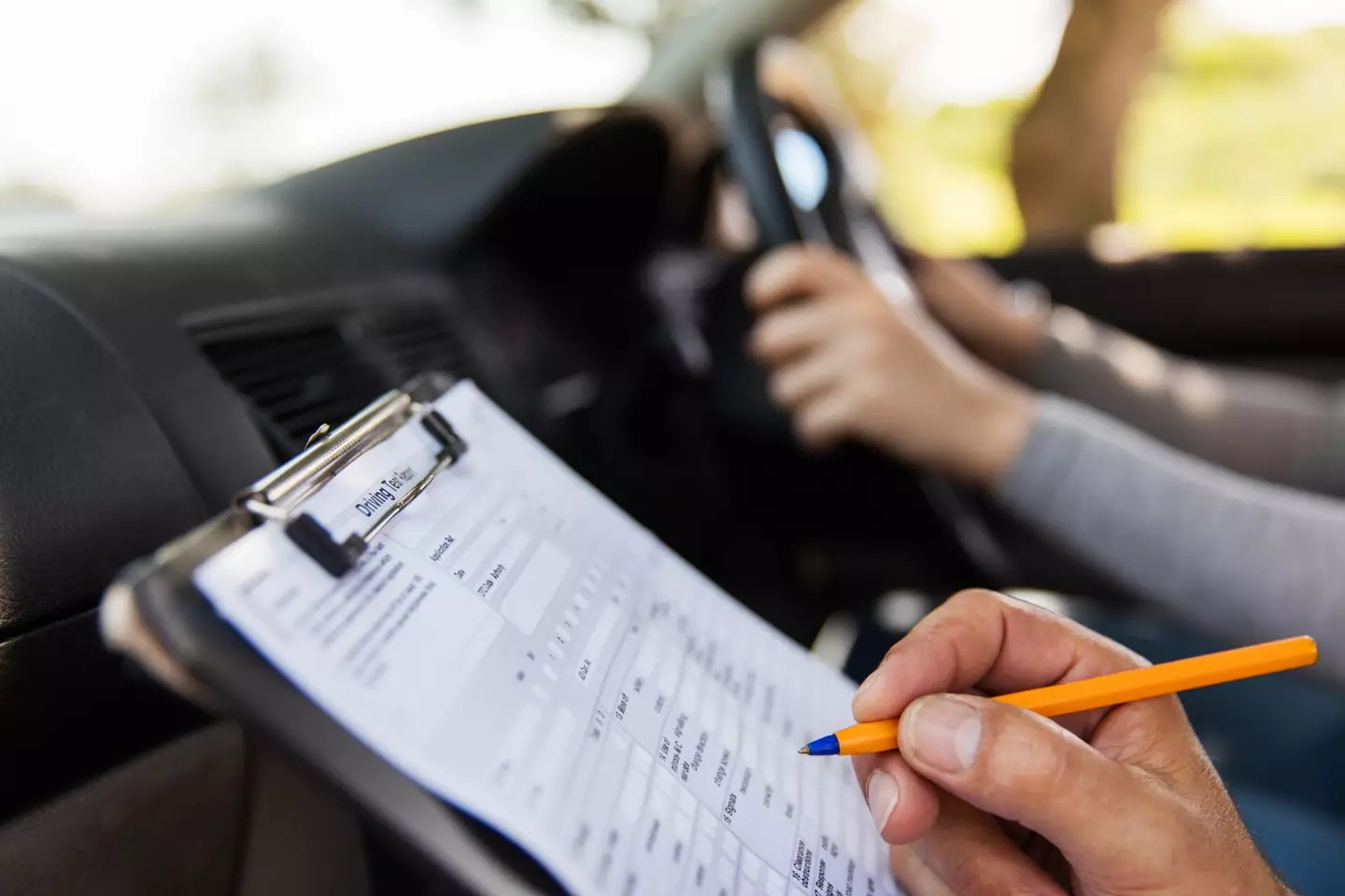 Driving test slots are being sold for five times the price online.