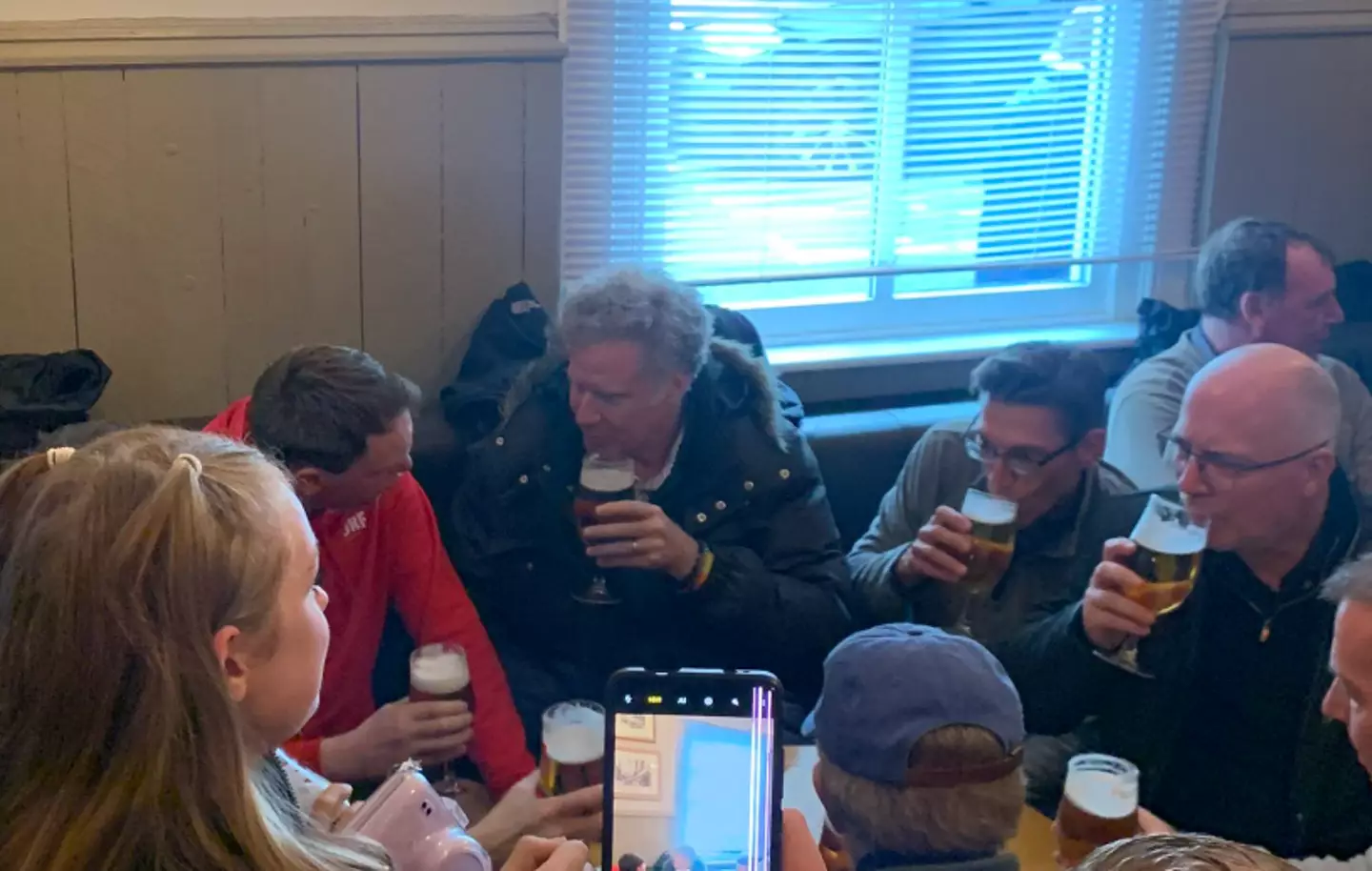 Ferrell was enjoying a pint before the football game.