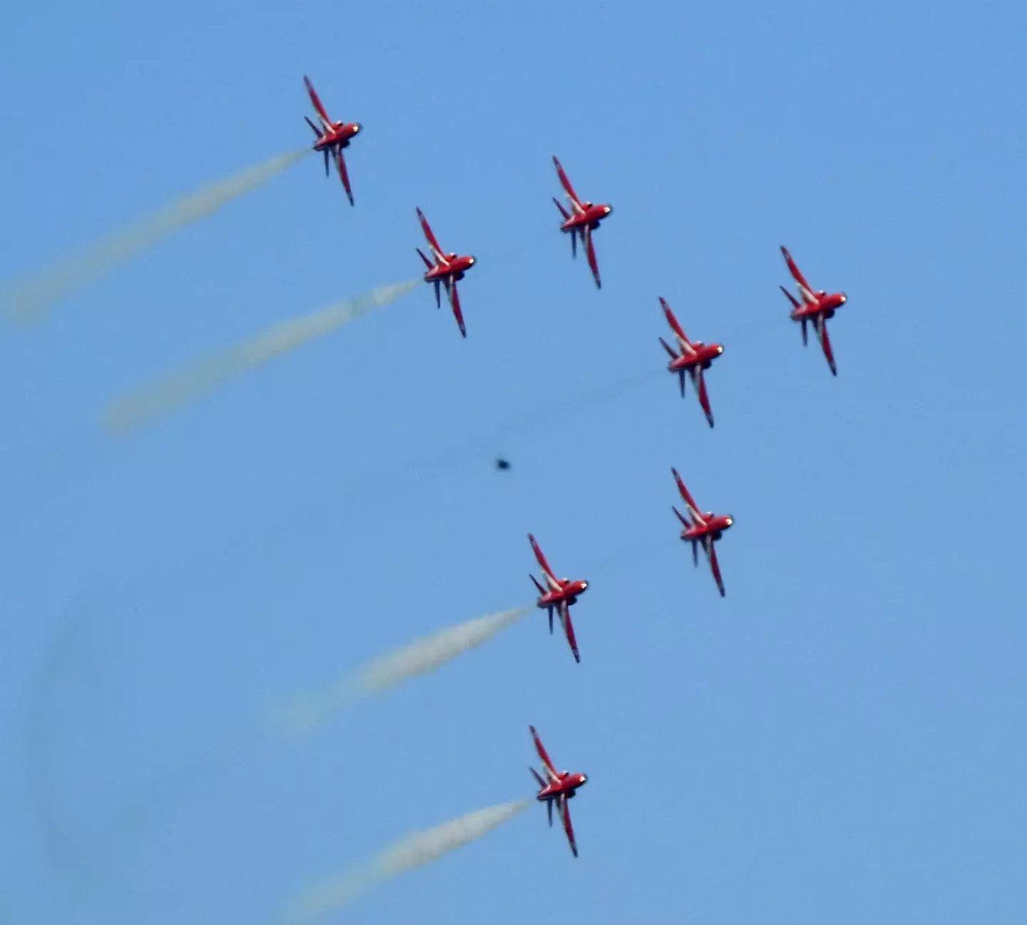 The Red Arrows soaring through the sky, but what's that in the background?
