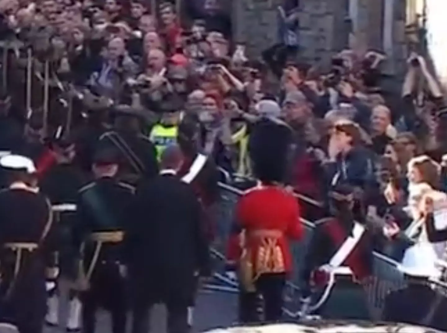 A protester was pulled away after shouting abuse at the Queen's coffin procession.