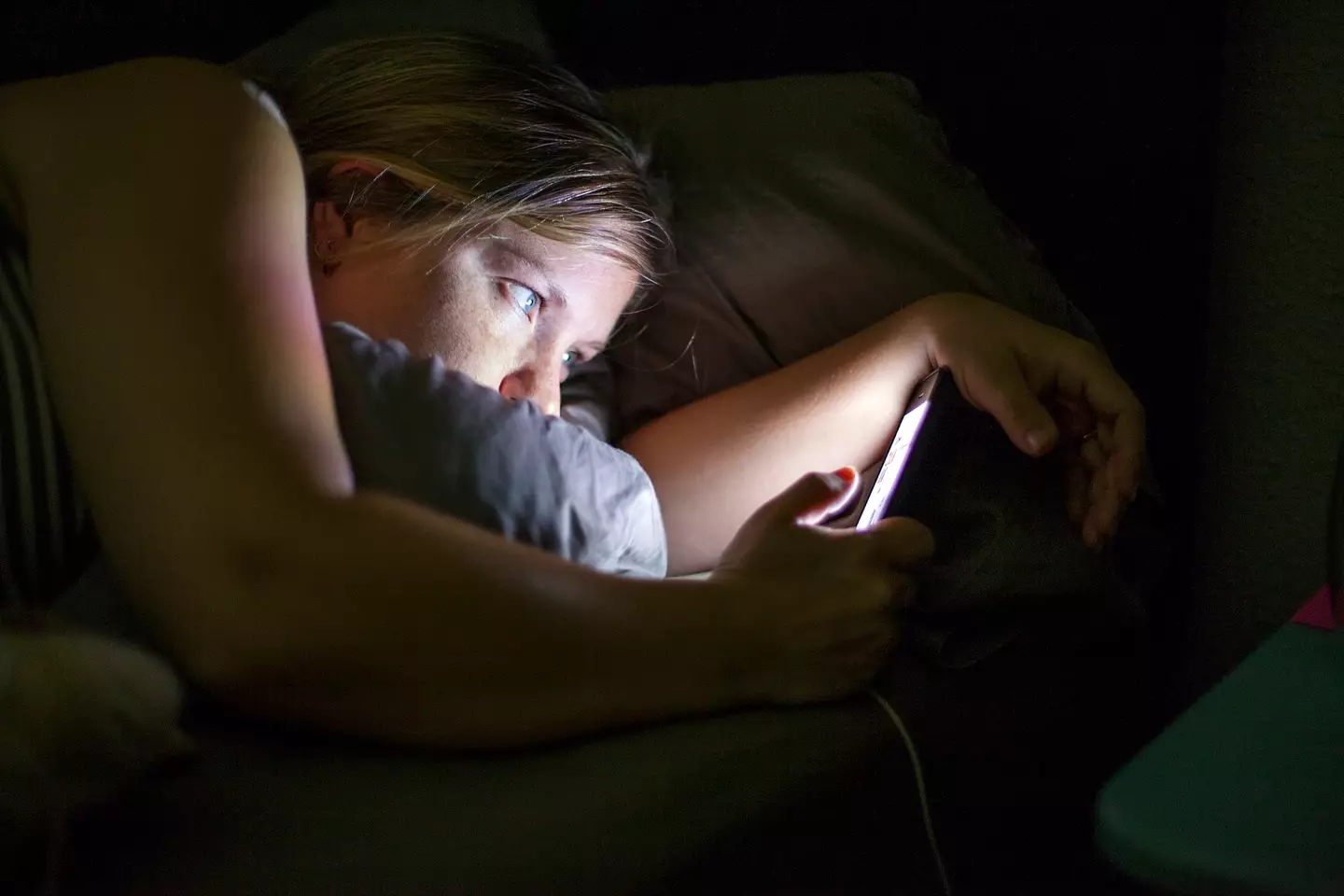 Many of us are guilty of doing this late at night. (Getty Stock Image)