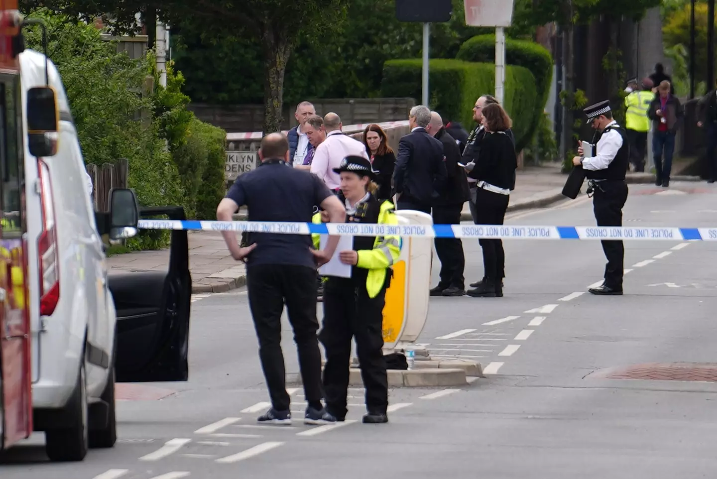 Police officers at Hainault, where the attack occurred. (PA)