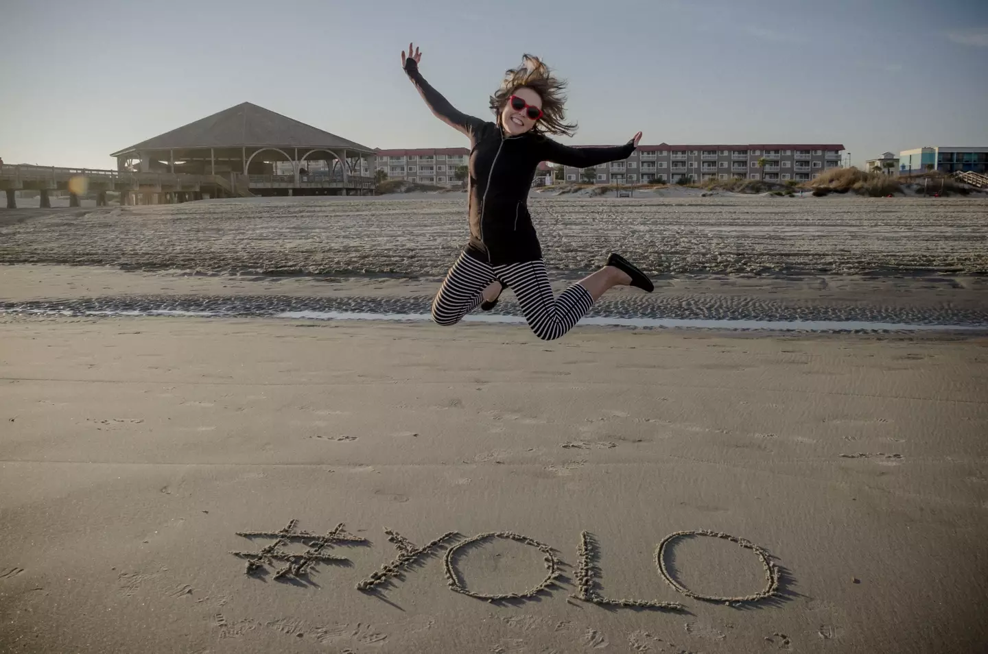 YOLO is dead and the lady in this picture probably has a mortgage now. (Getty Stock Photo)