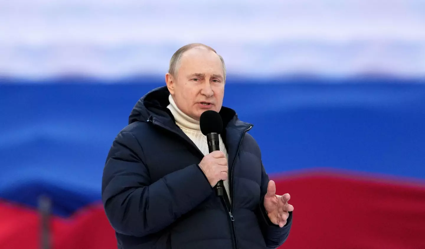 Vladimir Putin speaks at pro-war rally (Shutterstock)
