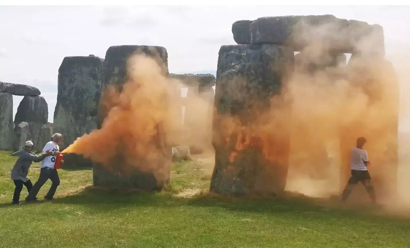 Stonehenge was blasted with orange paint on Wednesday by campaigners (X/@JustStop_Oil)