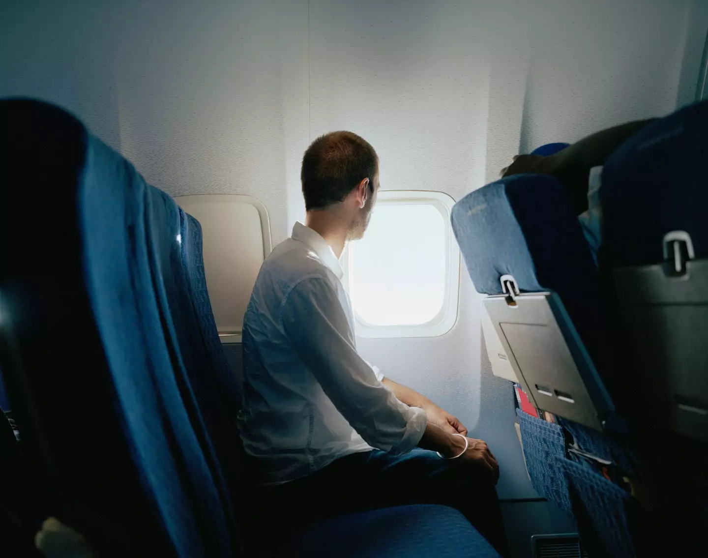 Men are raw-dogging on flights (Getty Stock Photo)