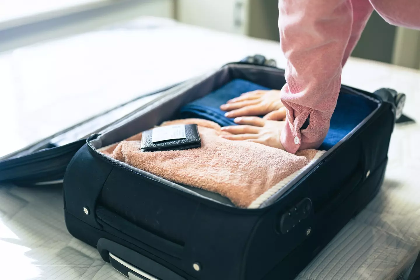 A man was recently denied boarding his flight after attempting to use a viral hack to avoid excess baggage charges (Getty Stock Image)