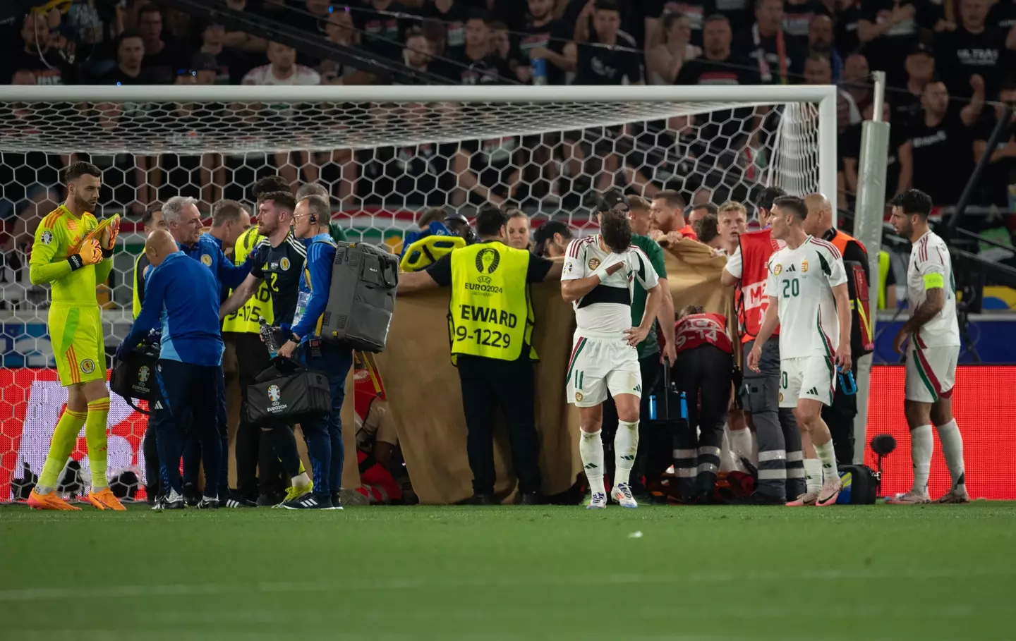 Players formed a protective wall around the striker as medics got to work on him. (Joe Prior/Visionhaus via Getty Images)