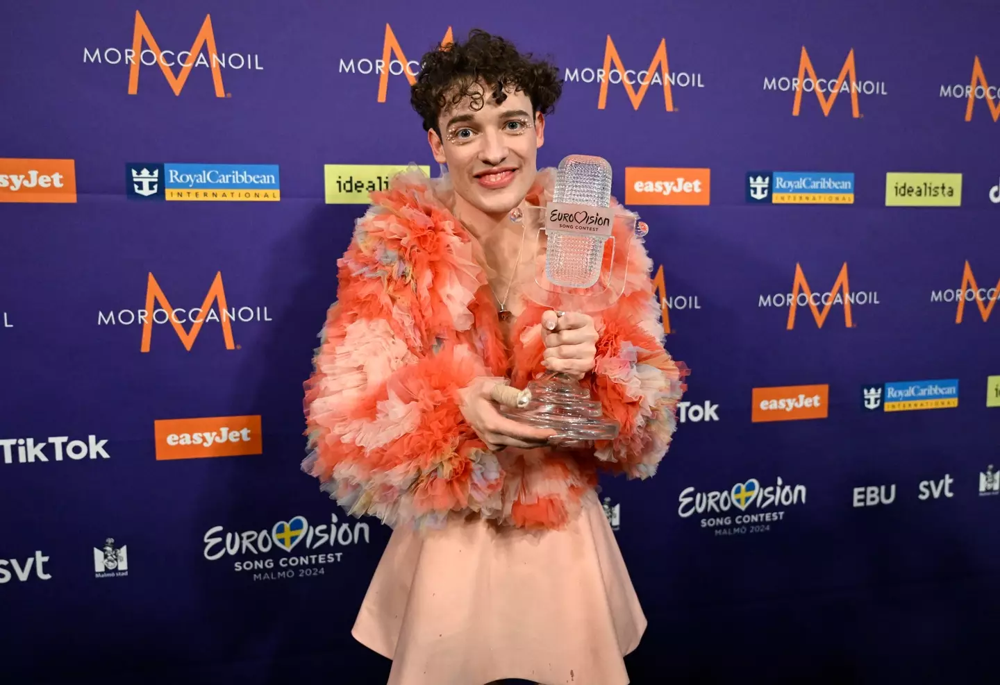 Nemo, representing Switzerland, holds their trophy after the final of the 68th edition of the Eurovision Song Contest. (JESSICA GOW/TT/TT NEWS AGENCY/AFP via Getty Images)