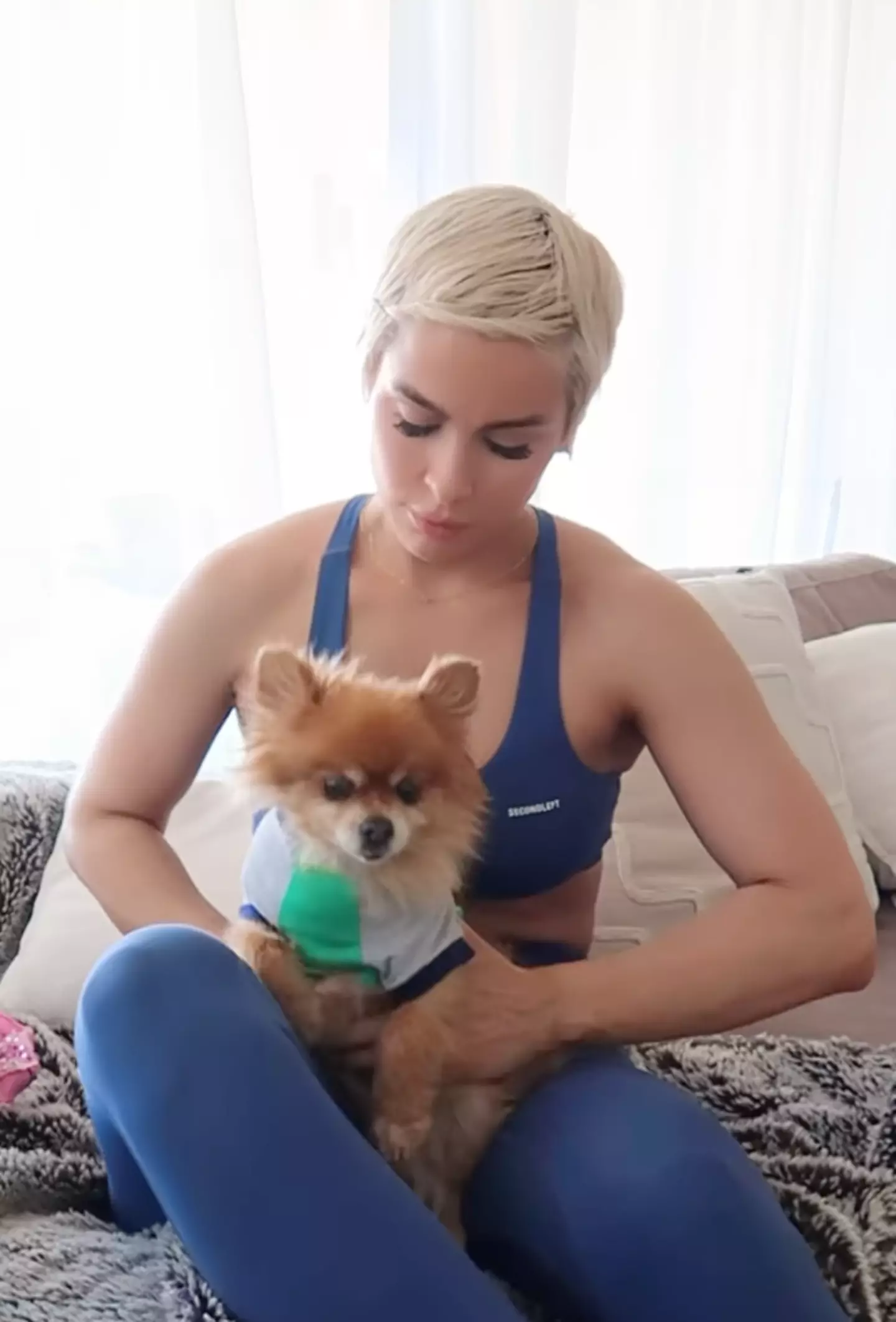 Ellie shared a video of her dressing her dog.