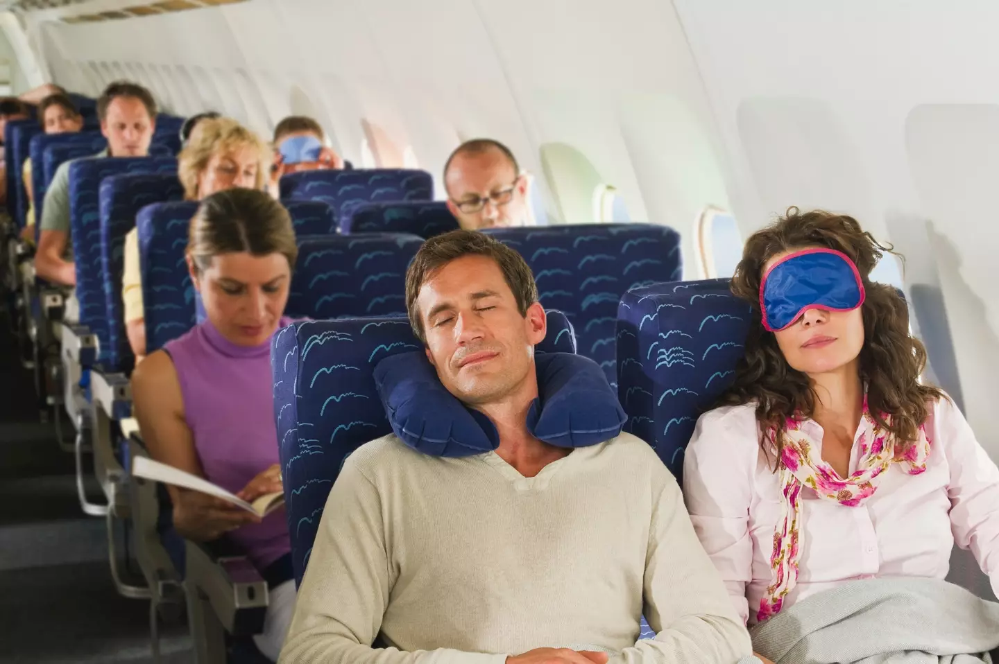 If you're going to sleep on a plane at least make sure it's taken off safely first. (Getty Stock Photo)