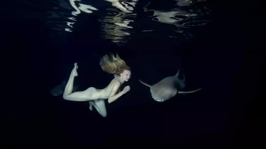 Model Swims Naked With Sharks To Show They're Not Scary... As You Do
