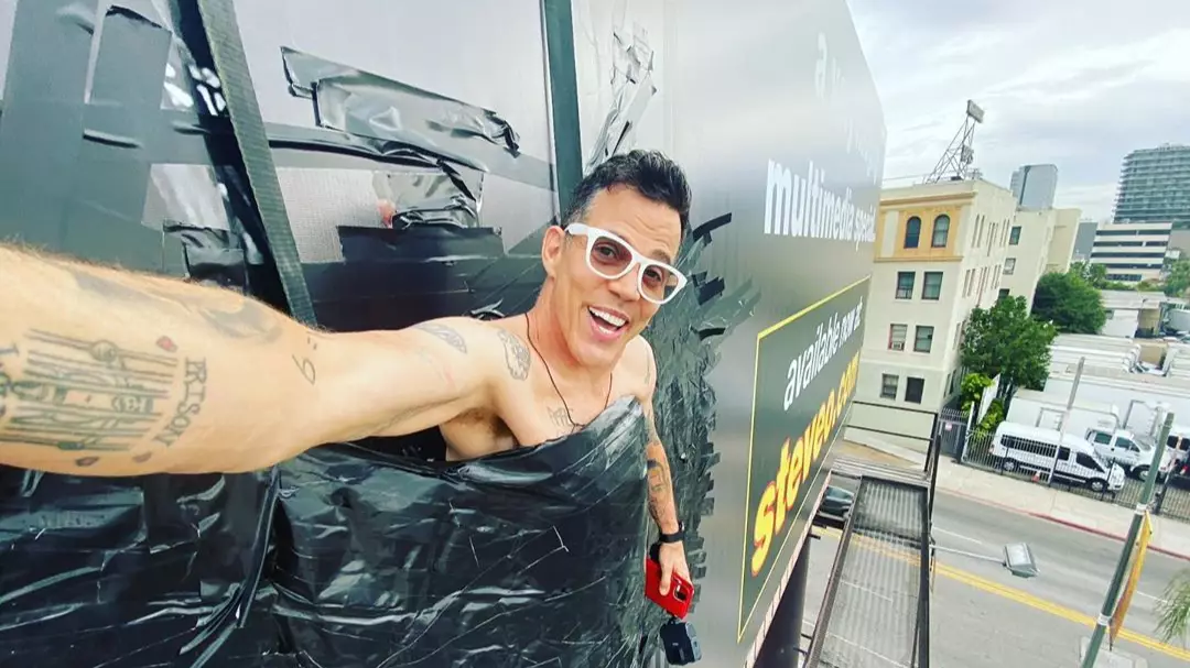 Steve-O Duct Tapes Himself To Billboard Before Being Freed By Fire Department 