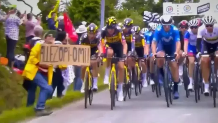 A fan holding a sign caused a massive pile-up in stage one of the Tour de France.