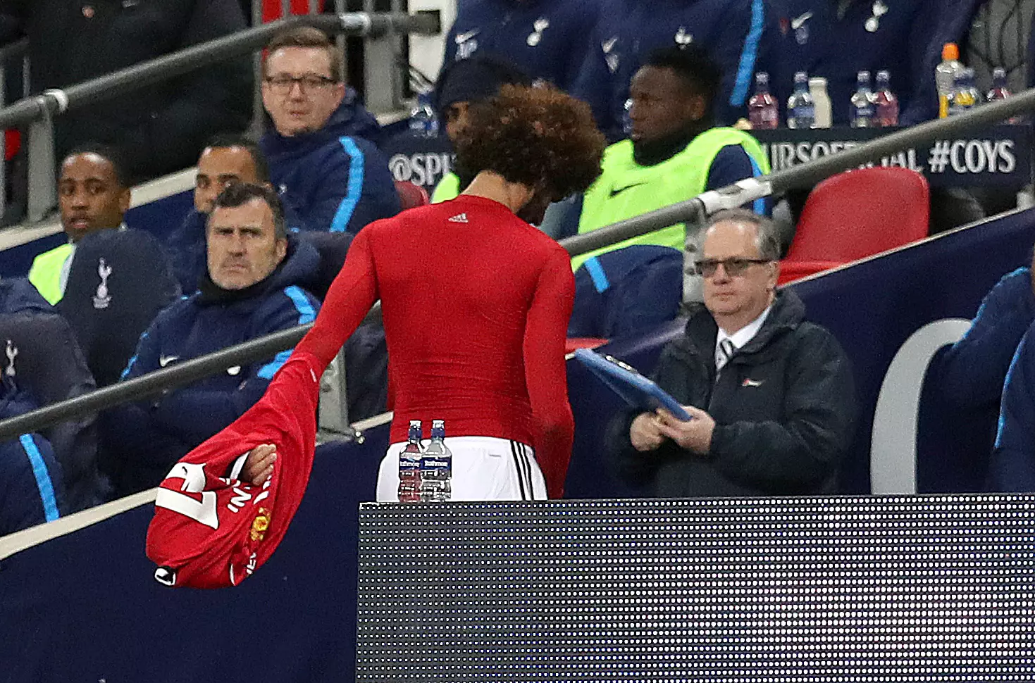 Fellaini wonders down the tunnel after his embarrassing substitution. Image: PA Images