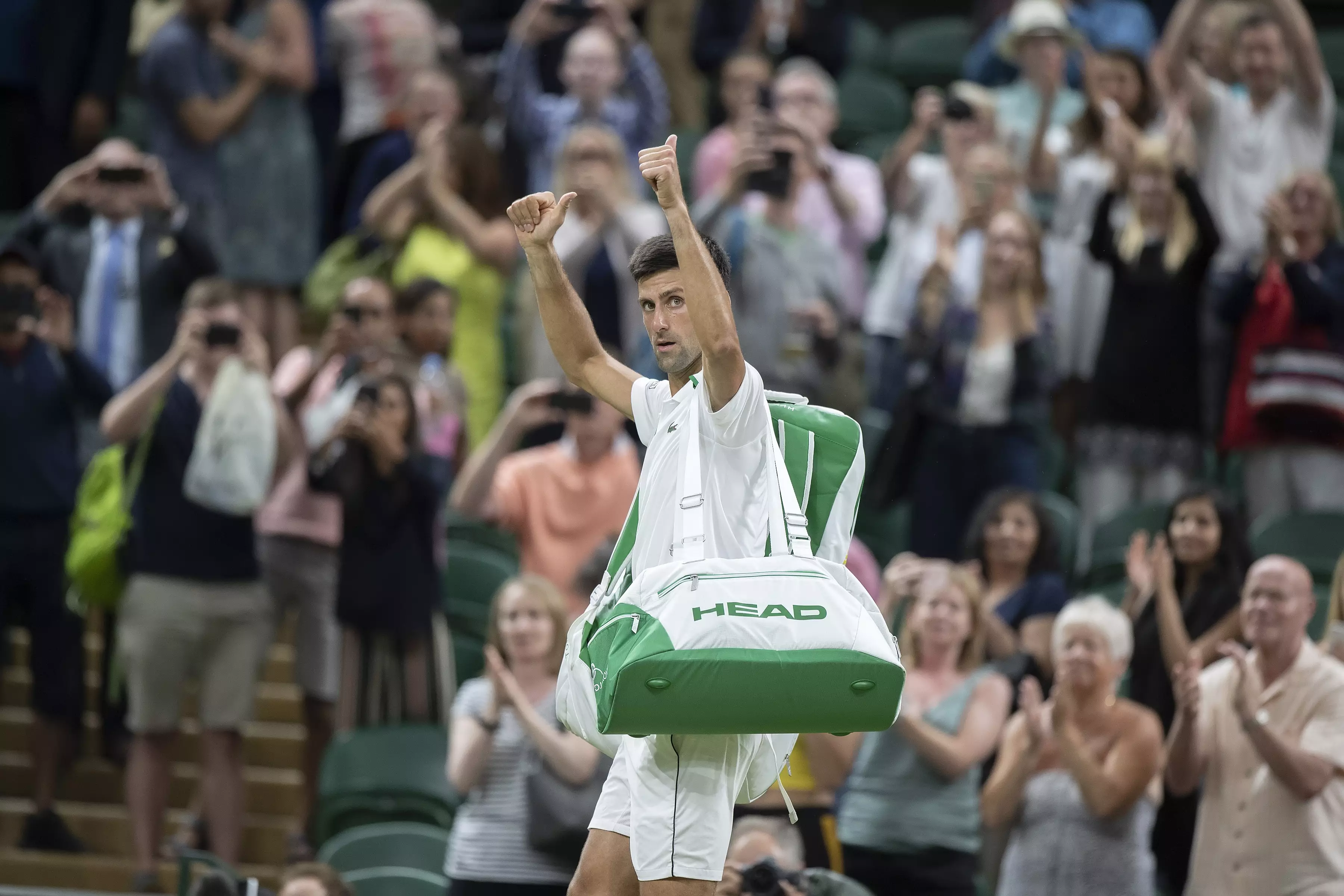 Djokovic walks off at the end of play on Friday with the match still in the balance. Image: PA Images