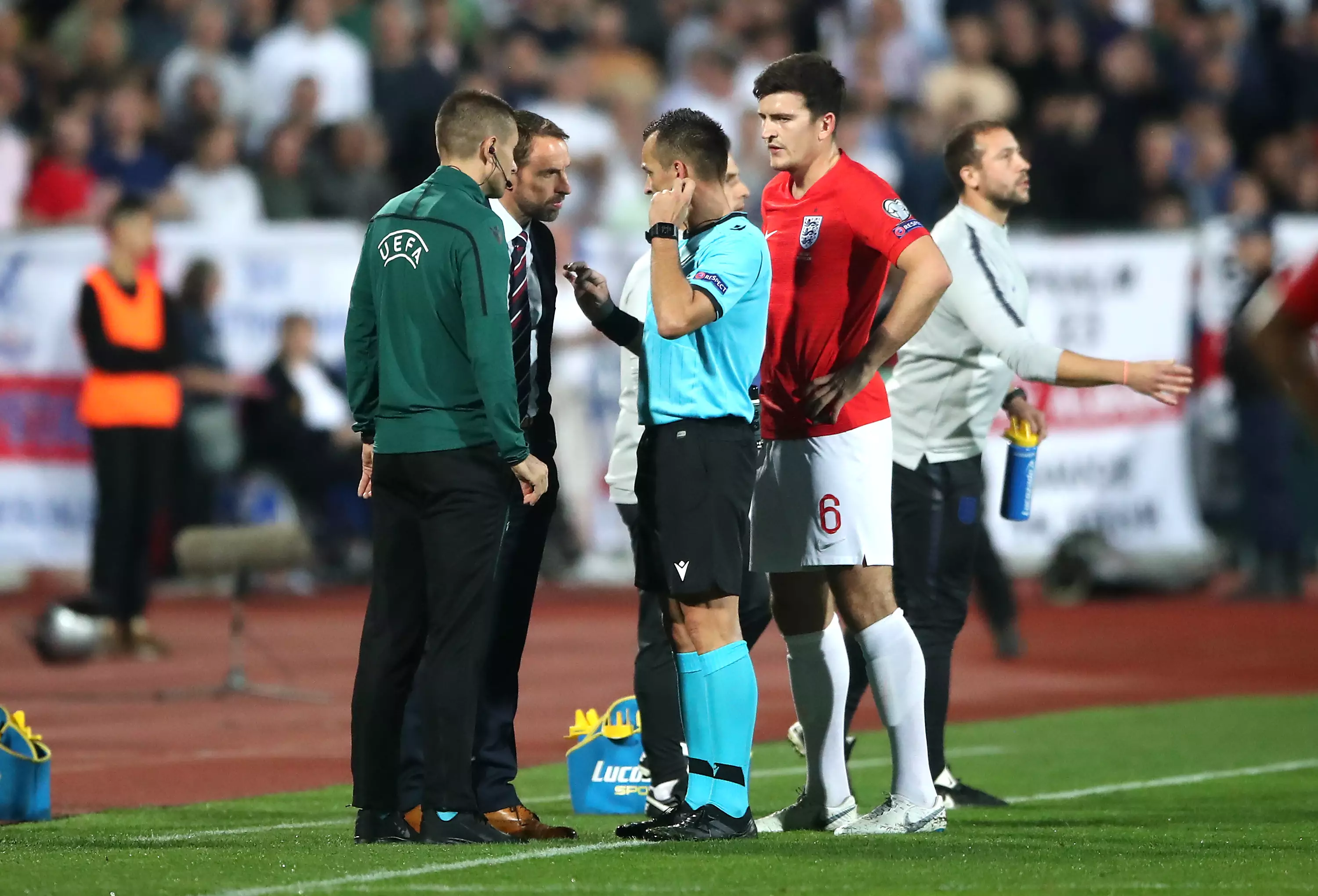 The referee talks to Gareth Southgate after stopping the game. Image: PA Images