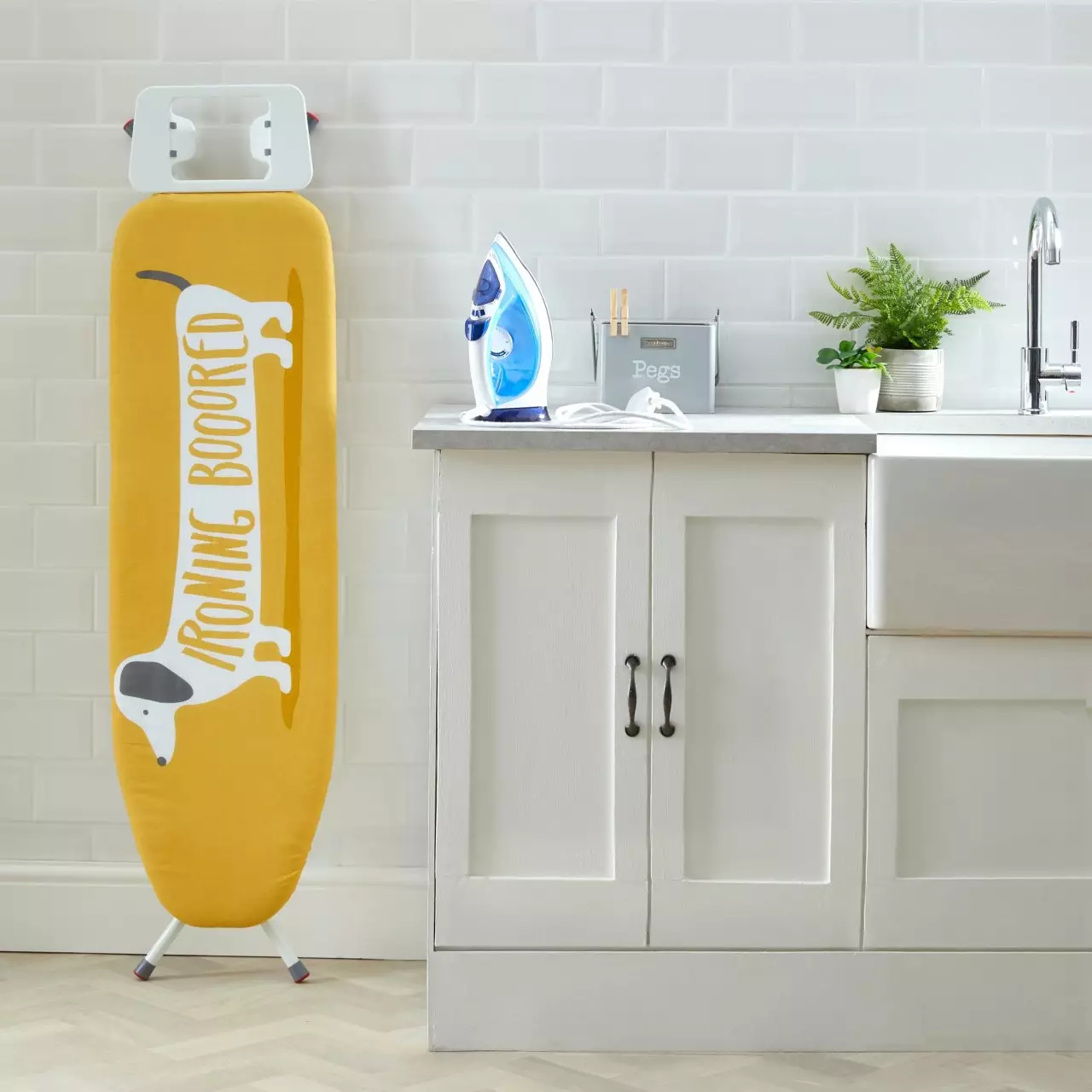You'll need this adorable ironing board cover (