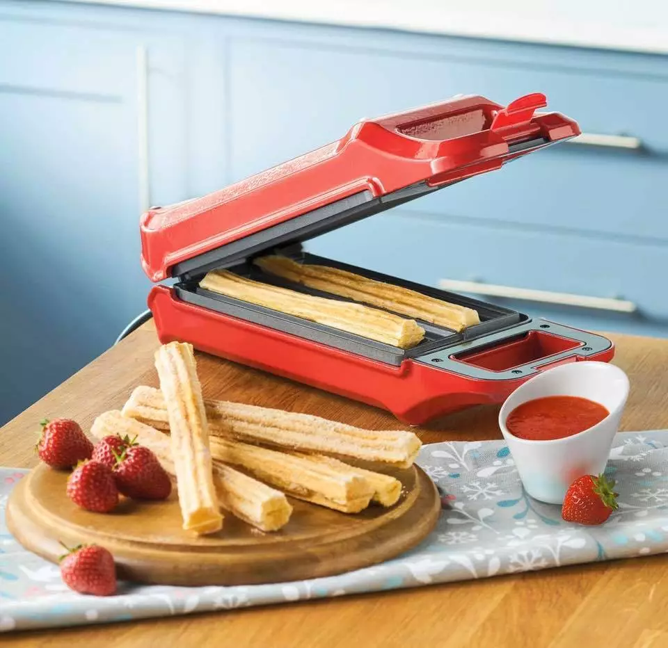 The device has a sleek red exterior and non-stick surfaces (