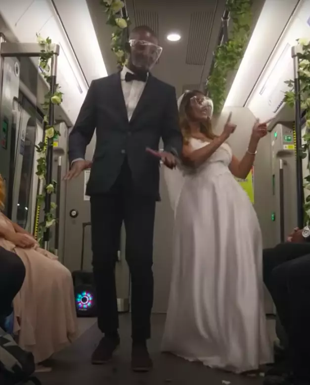 The 'bride' and 'groom' then boogied down the train aisle (